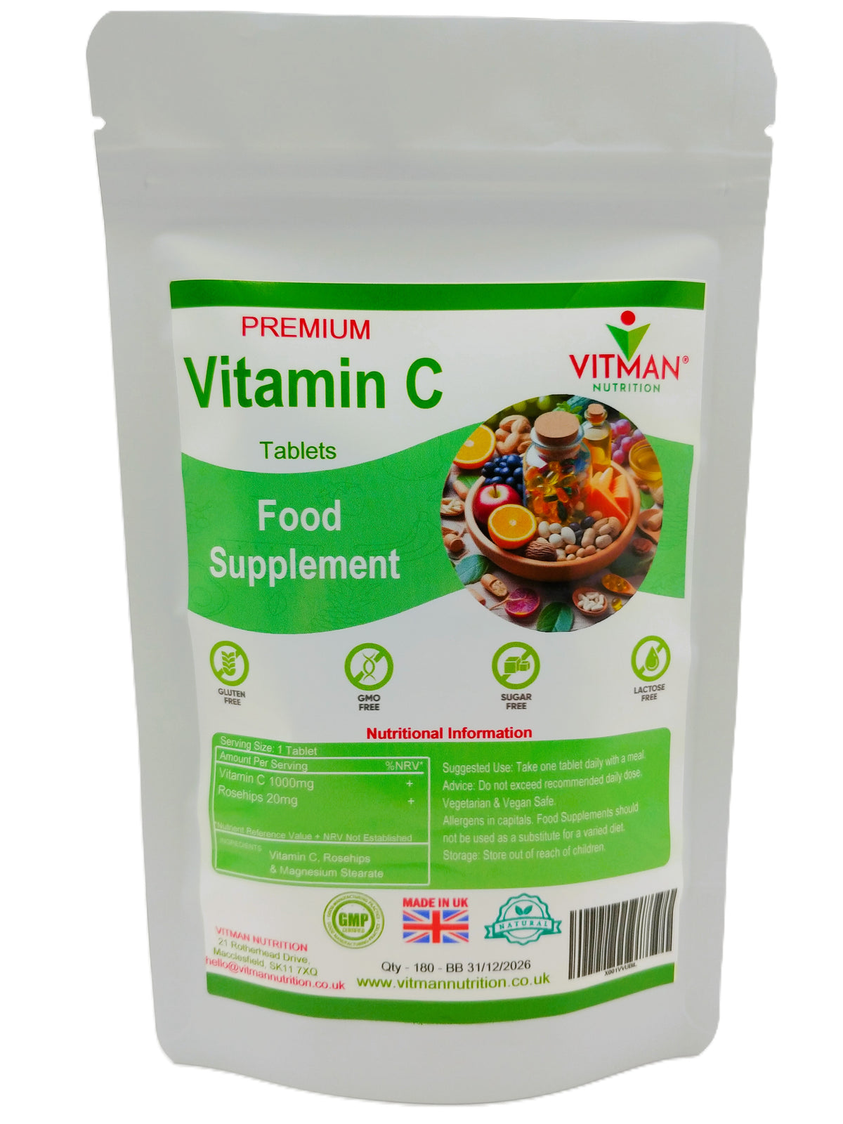 A white stand-up pouch of Vitman Nutrition Premium Vitamin C Tablets Food Supplement, featuring a green and white label with a colorful fruit and vegetable illustration.